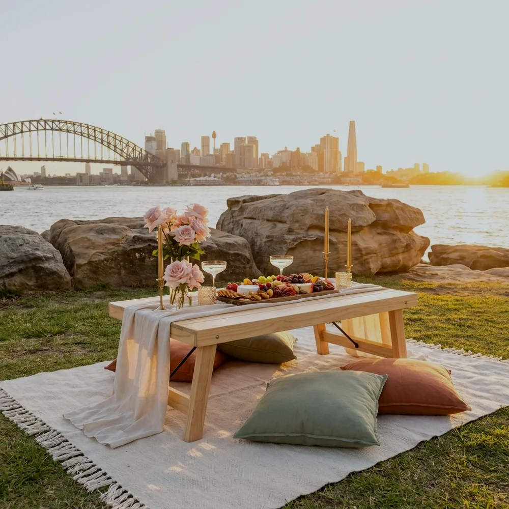 Date night picnic for two styled on a Sydney harbourside headland at sunset